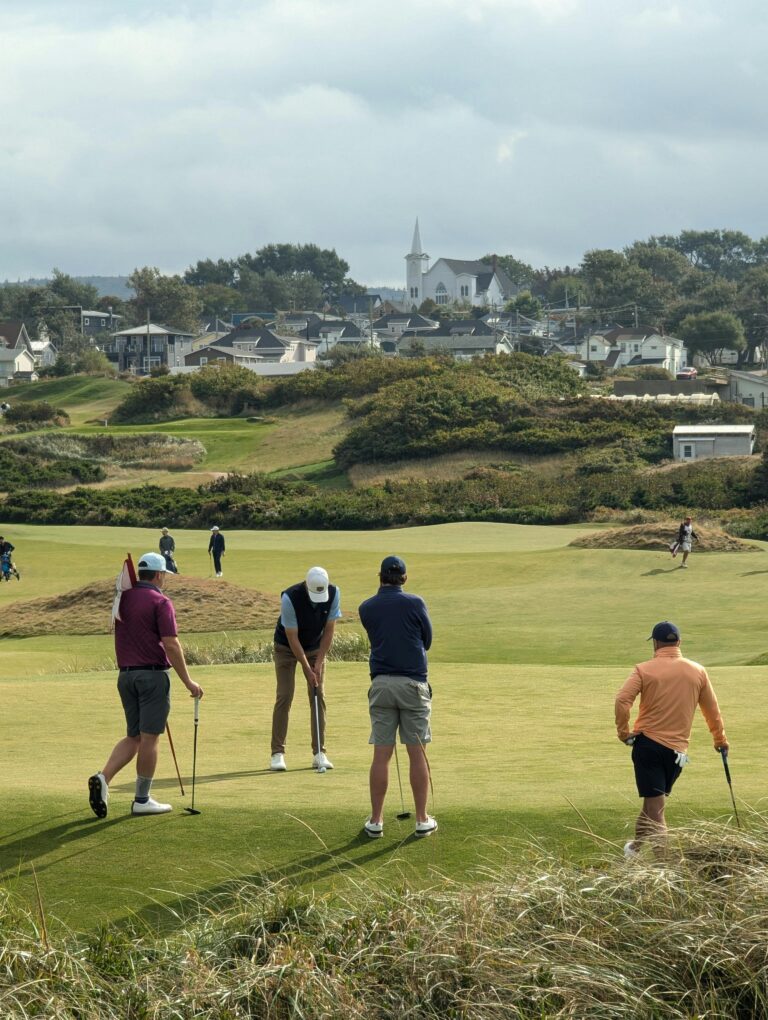 Group of golfers playing on a scenic course in Cape Breton, NS, Canada.